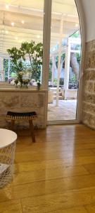 a room with a bench and a large window at BorgoAntico34 - Luxury Room in Molfetta