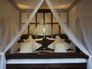 Katil atau katil-katil dalam bilik di Firefly Estate Bequia