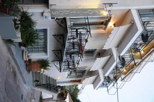 an overhead view of a building with stairs and plants at Arolithos in Spetses