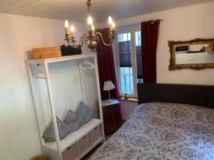 Postel nebo postele na pokoji v ubytování Casa Restelli EG - nahe Andermatt Gotthard
