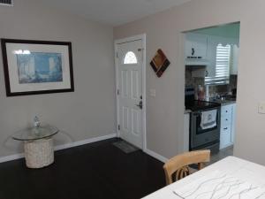 a kitchen with a table and a dining room at WelcomeHomeLakeland, FL in Lakeland
