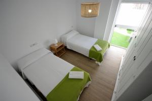 Posteľ alebo postele v izbe v ubytovaní Livingtarifa Los 4 vientos