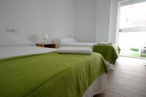 Posteľ alebo postele v izbe v ubytovaní Livingtarifa Los 4 vientos