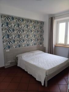 A bed or beds in a room at Resort Orizzonti Még 25 kép