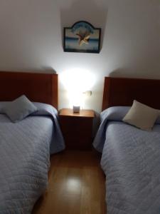 A bed or beds in a room at Isla de Tambo