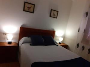 A bed or beds in a room at Isla de Tambo