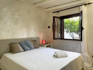 מיטה או מיטות בחדר ב-Xenìa - Villa con Piscina Privata
