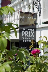 a sign for the liverpool national orassis grand prix on a building at Le Mange Grenouille in Bic