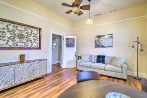 a living room with a couch and a ceiling fan at Cozy Carpinteria Apartment Walkable Location in Carpinteria