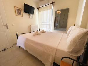 Posteľ alebo postele v izbe v ubytovaní Nafplio Downtown Apartment