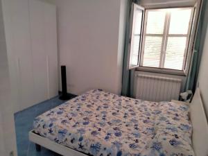 A bed or beds in a room at La casetta dei limoni