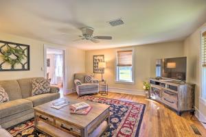 a living room with a couch and a tv at Finger Lakes Farm Retreat Walk to Wineries! in Hector