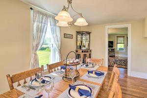 a dining room with a table and chairs and a window at Finger Lakes Farm Retreat Walk to Wineries! in Hector