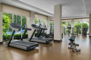 a gym with several treadmills and elliptical machines at The Seagate Hotel & Spa in Delray Beach