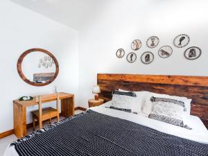 a bedroom with a bed and plates on the wall at Coco Rise Villas - Villa Dining Service Available in Bwejuu +57 photos