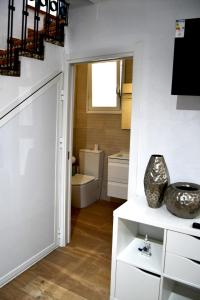 a bathroom with a staircase leading to a room with a toilet at Casa VALOLI PLAYA MIRAMAR in Miramar +43 photos