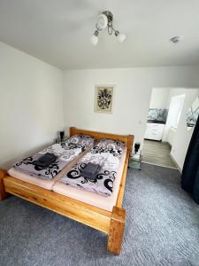 Posteľ alebo postele v izbe v ubytovaní Penzion Rozárka