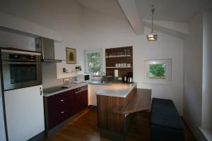 a kitchen with a sink and a counter top at Appartements Zur Kapelle in Kaprun