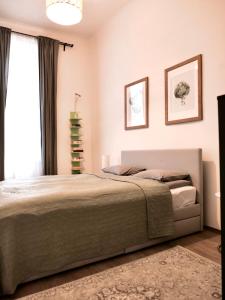 Postel nebo postele na pokoji v ubytování Contemporary City Apartment Váci Utca