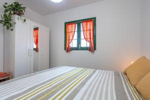 Postel nebo postele na pokoji v ubytování CASA IGNAZIA in Lajares