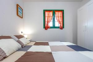 Postel nebo postele na pokoji v ubytování CASA IGNAZIA in Lajares