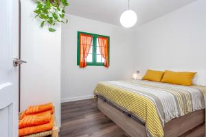 Postel nebo postele na pokoji v ubytování CASA IGNAZIA in Lajares