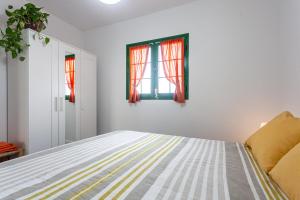 Postel nebo postele na pokoji v ubytování CASA IGNAZIA in Lajares