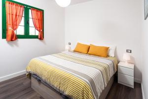 Postel nebo postele na pokoji v ubytování CASA IGNAZIA in Lajares