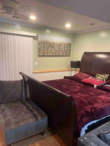 a bedroom with a bed and a couch at Guest Room in Eatontown