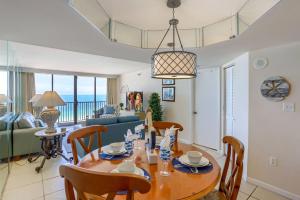a dining room and living room with a table and chairs at 1506 Lighthouse Towers in Clearwater Beach