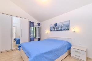 Posteľ alebo postele v izbe v ubytovaní Apartman Ursula Stivan