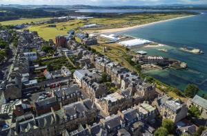 an aerial view of a city next to the water at The Arran, St Andrews in St. Andrews