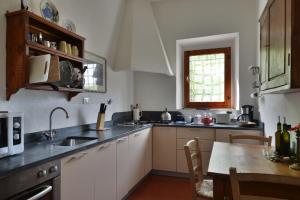 A kitchen or kitchenette at Fattoria il Leccio - Elegant Suite on Florence Hills