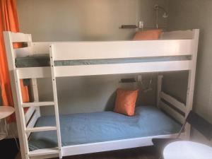 a couple of bunk beds in a room at Beach House Ystad in Ystad