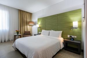 Krevet ili kreveti u jedinici u okviru objekta Holiday Inn Express - Cartagena Bocagrande, an IHG Hotel