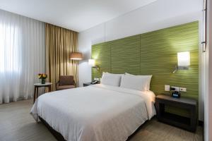 เตียงในห้องที่ Holiday Inn Express - Cartagena Bocagrande, an IHG Hotel