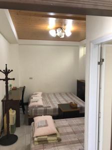 Postel nebo postele na pokoji v ubytování Dongyin Homestay連江縣民宿054號
