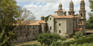 an old castle with two towers on top of it at Stone Cottage La COMPOSTELANA in Curtis