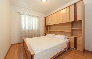 Postel nebo postele na pokoji v ubytování Apartmani IvaMia