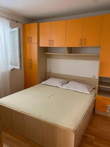 Postel nebo postele na pokoji v ubytování Apartmani IvaMia