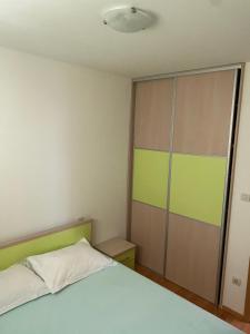 Postel nebo postele na pokoji v ubytování Apartmani IvaMia