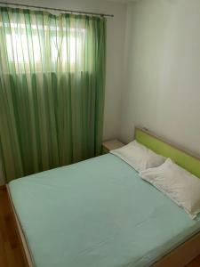 Postel nebo postele na pokoji v ubytování Apartmani IvaMia