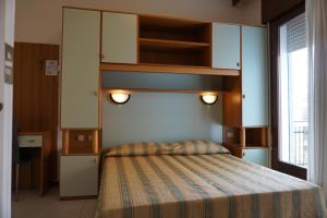 Ένα ή περισσότερα κρεβάτια σε δωμάτιο στο Hotel Ideal Sottomarina