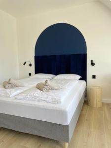 Posteľ alebo postele v izbe v ubytovaní Dubois Apartments Kołobrzeg