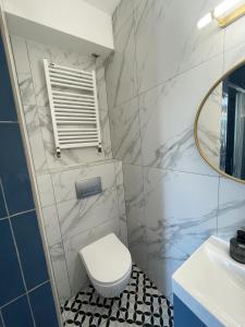 Kúpeľňa v ubytovaní Dubois Apartments Kołobrzeg