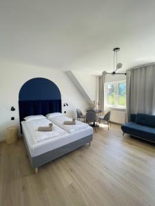 Ένα ή περισσότερα κρεβάτια σε δωμάτιο στο Dubois Apartments Kołobrzeg