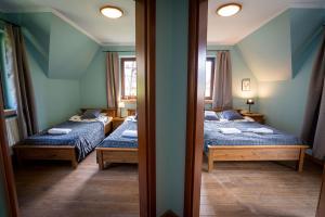 Posteľ alebo postele v izbe v ubytovaní Apartamenty Góralmobile Zakopane