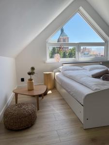 Posteľ alebo postele v izbe v ubytovaní Dubois Apartments Kołobrzeg