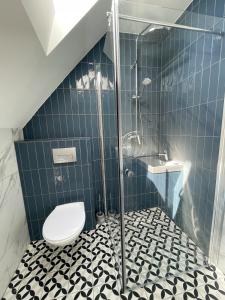 Kúpeľňa v ubytovaní Dubois Apartments Kołobrzeg