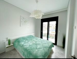A bed or beds in a room at Luxury Apartment Nikiti Olea Valley